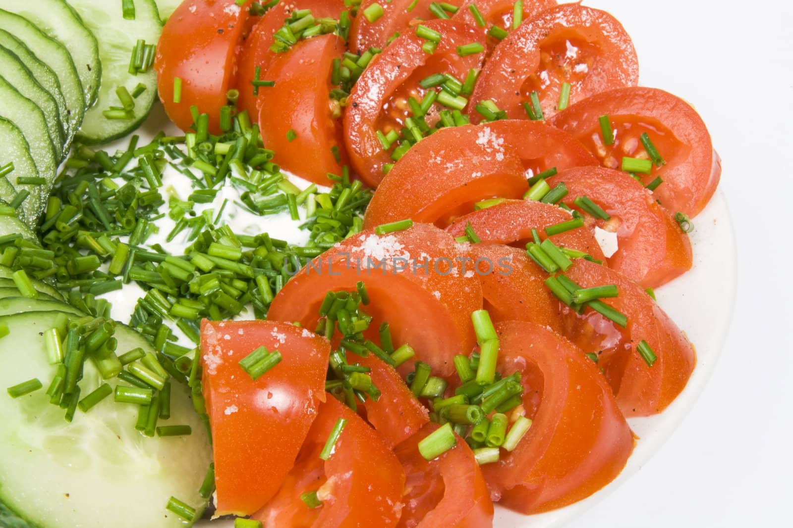 Fresh vegetable salad - tomatoes and cucumber with green onion