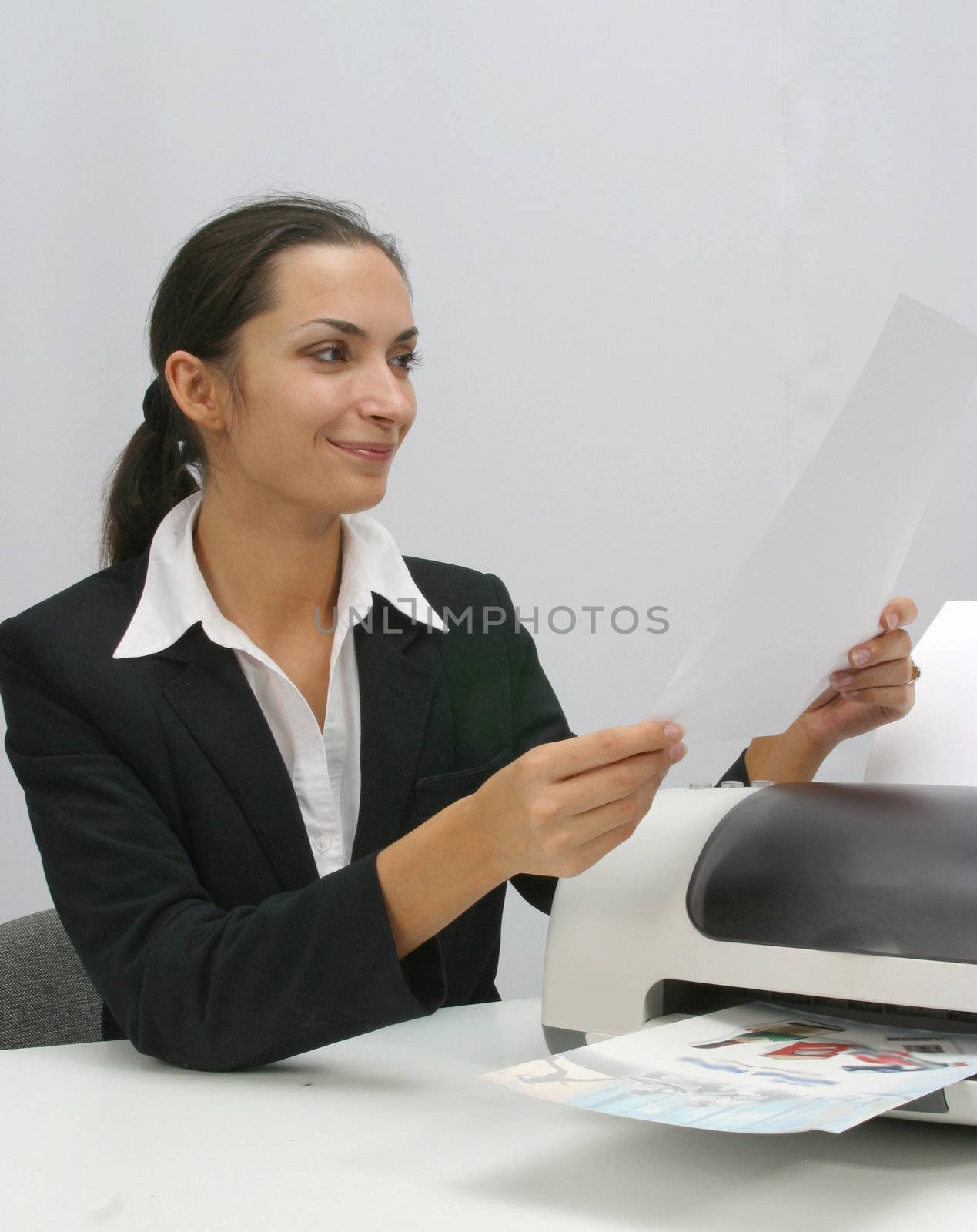 Business woman is prinring in office, copy, duplicate, calling