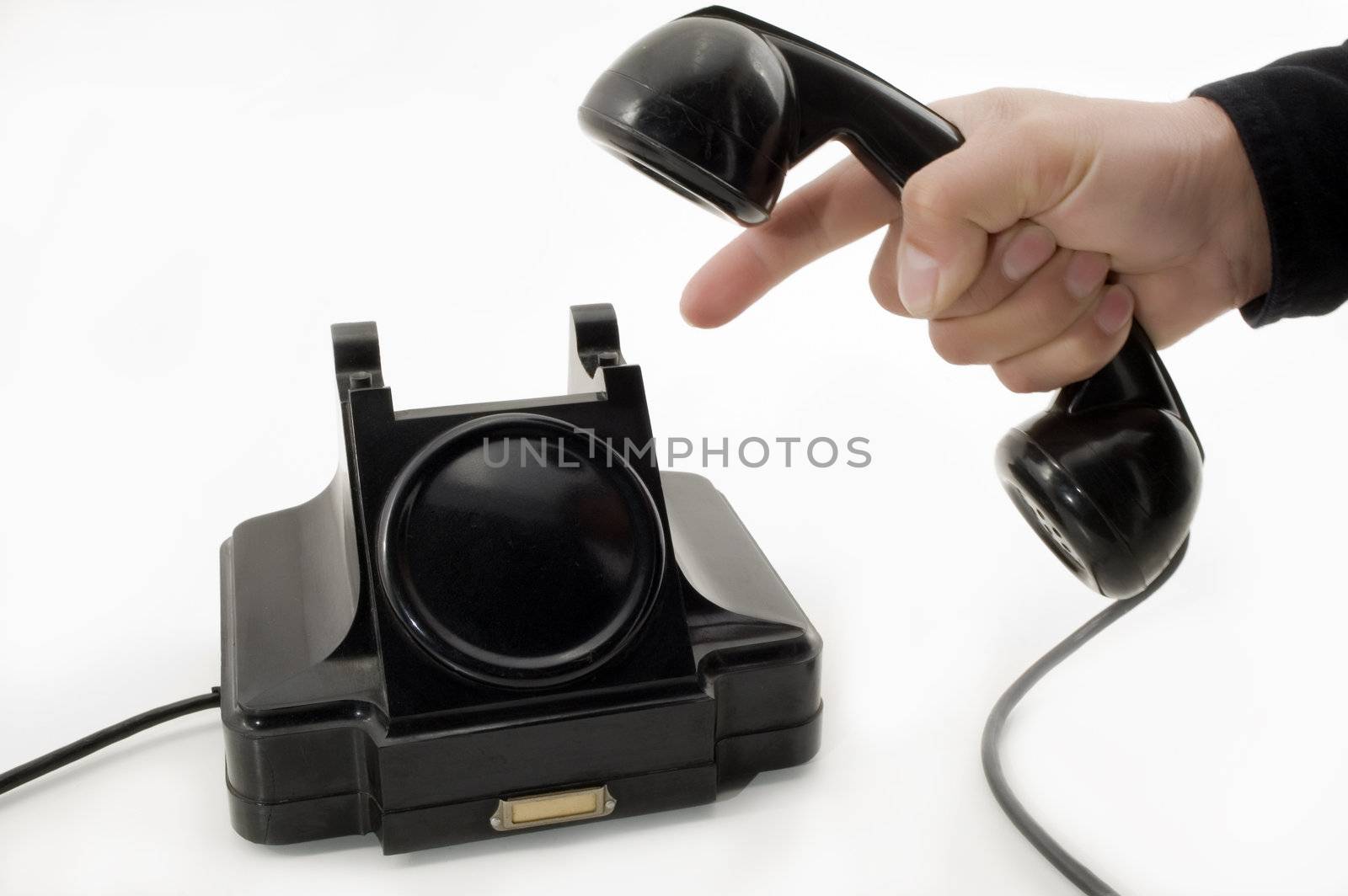 Telephone receiver in hand, isolated on white background.