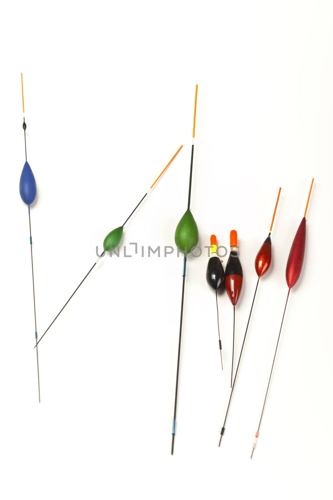 Image of fishing bobbers on reflective surface