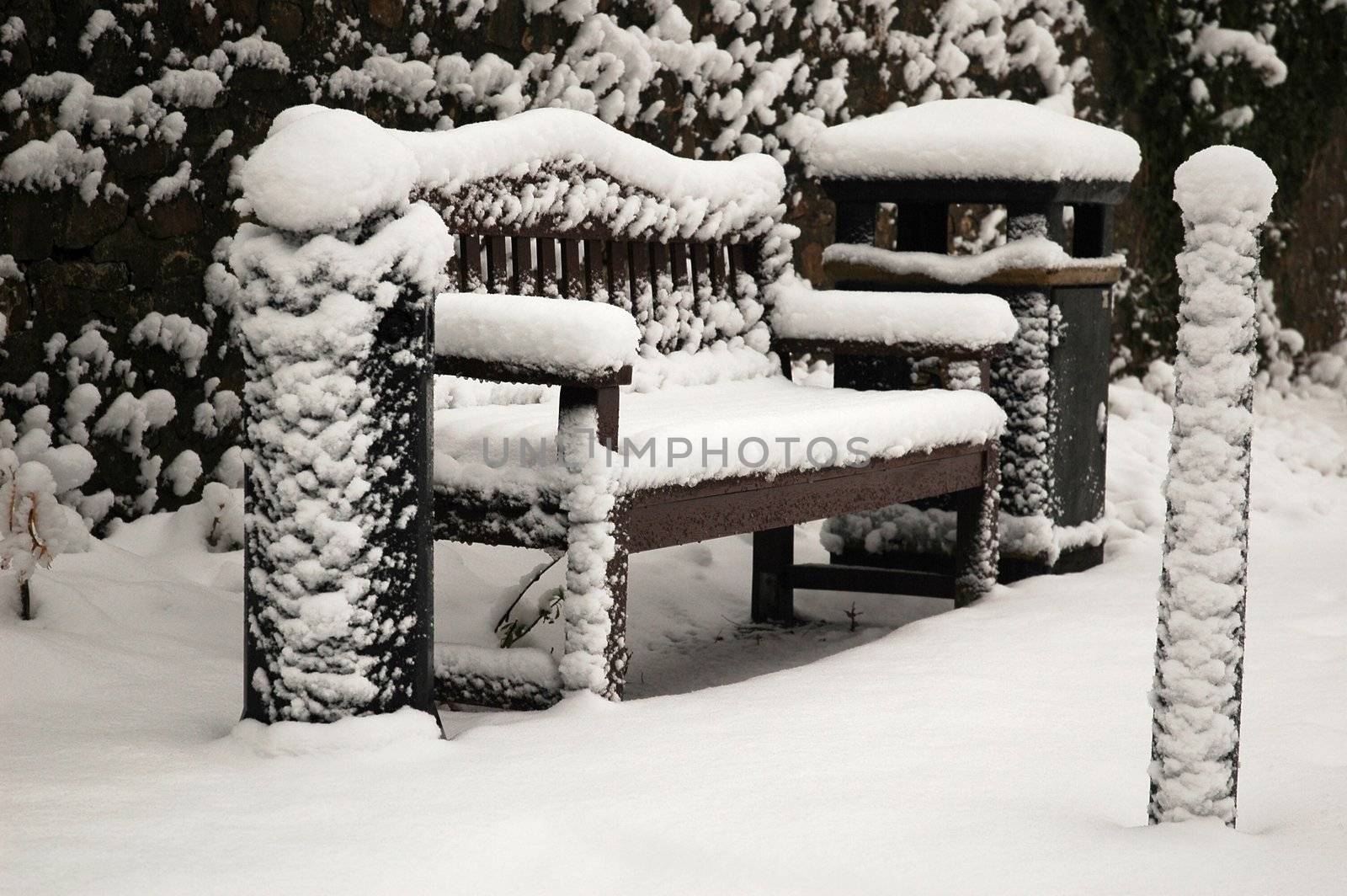 bench covered by snow, horizontally framed shot