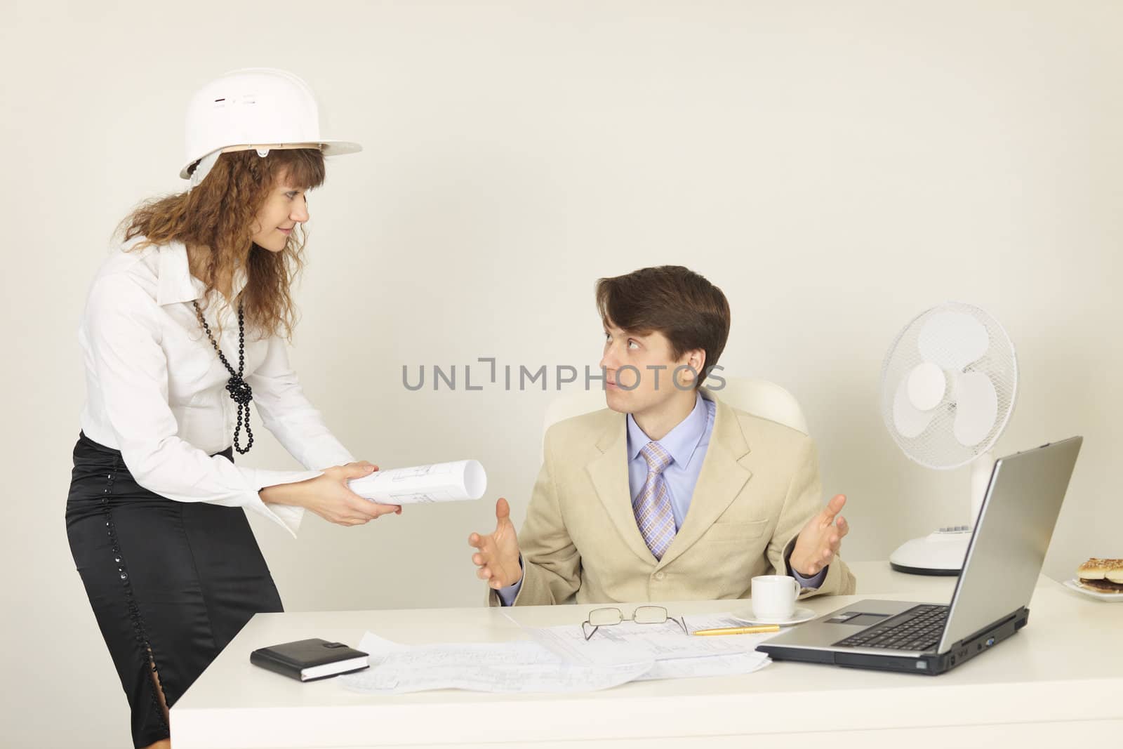 Pair of young businessmen on a workplace