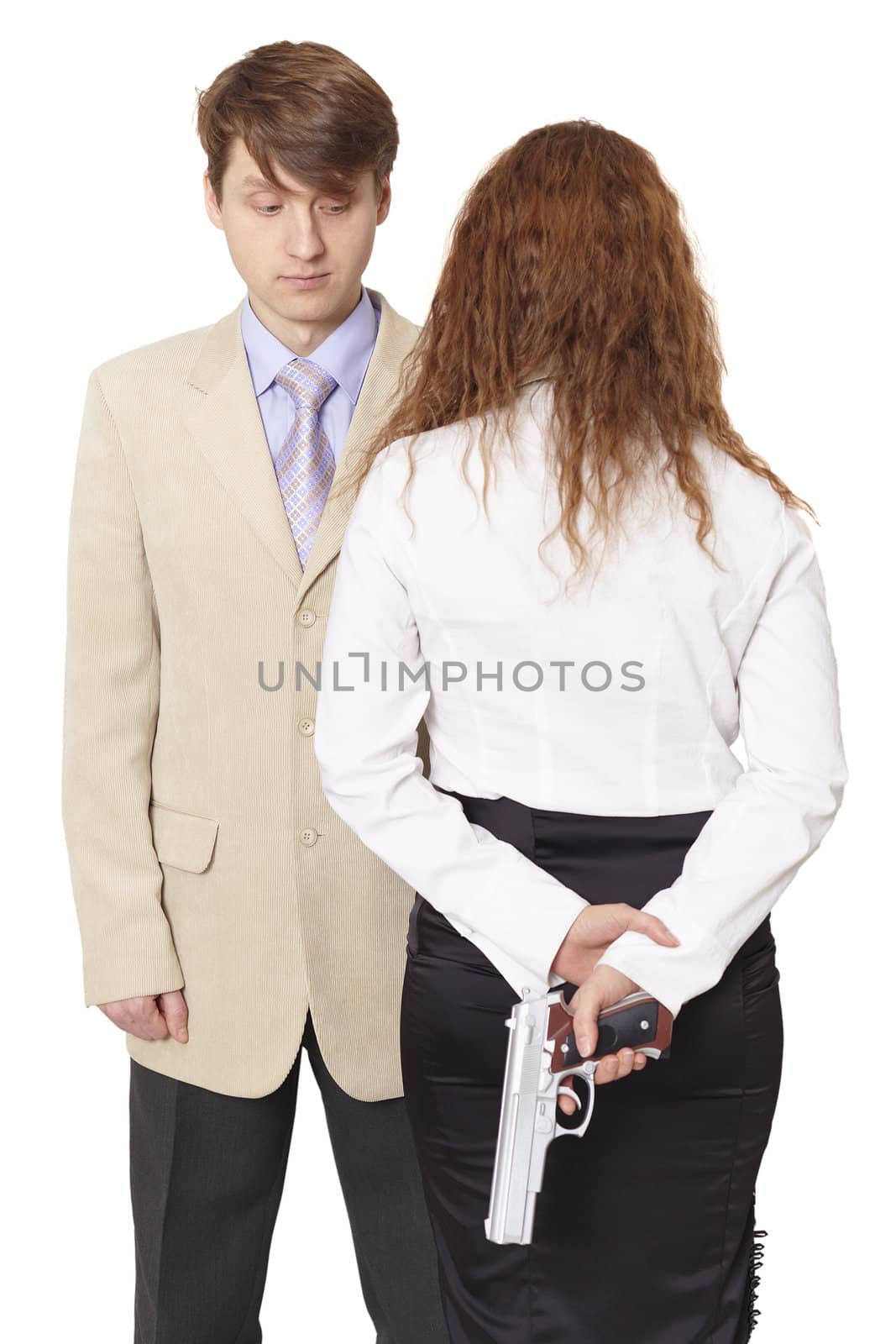 The young man and the woman armed with a pistol isolated on white