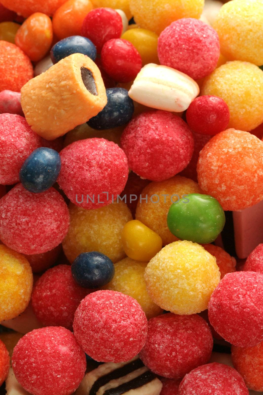 Horizontal background made of multi-coloured sweets, (look similar images in my portfolio)