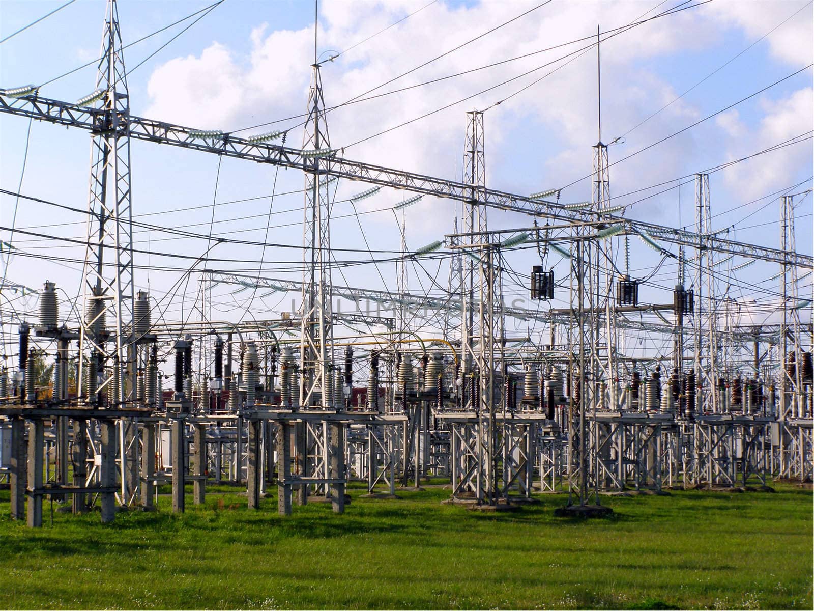 power station equipment under cloudy blue sky      