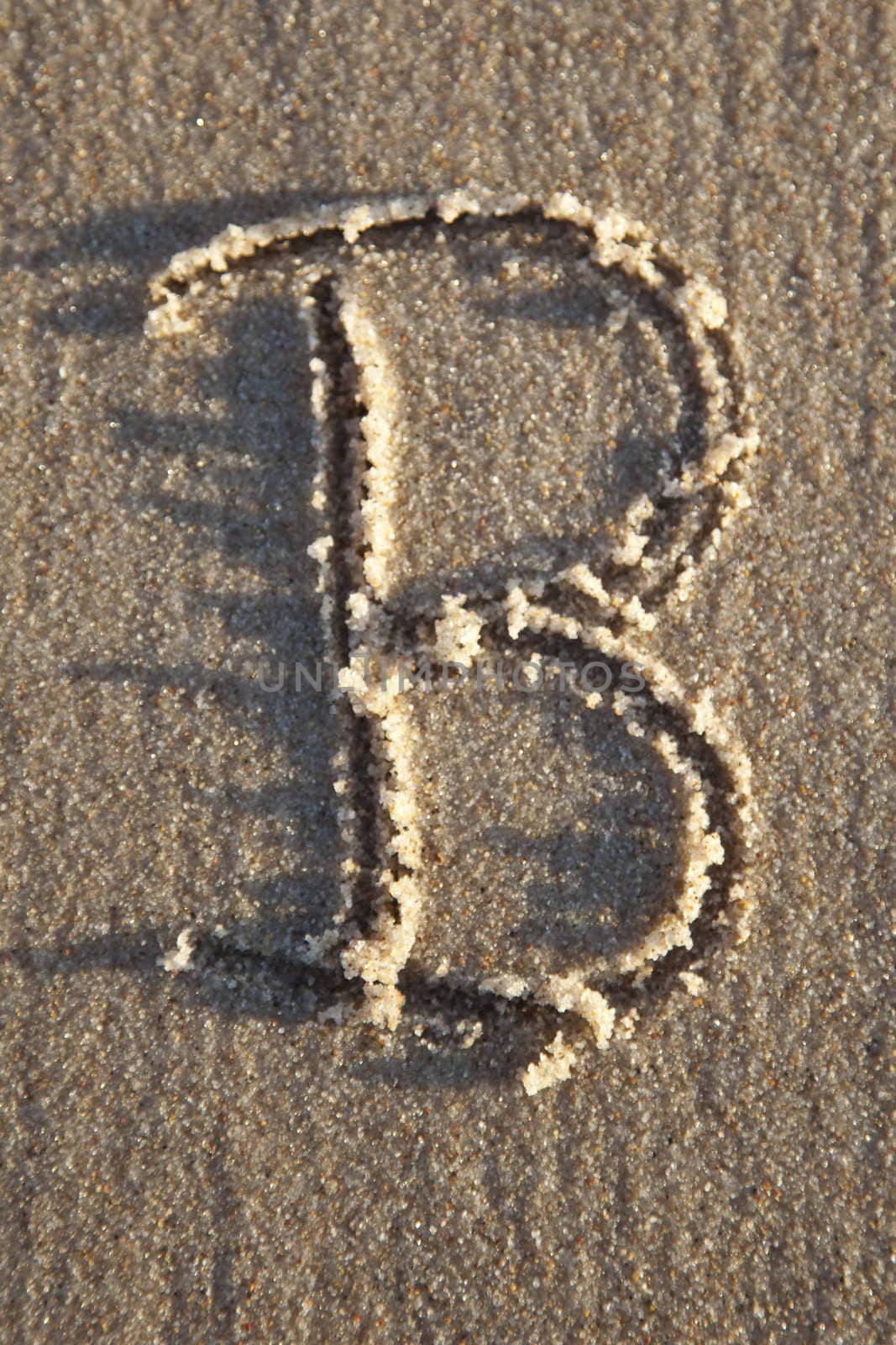 Letter written on wet sand by shiffti