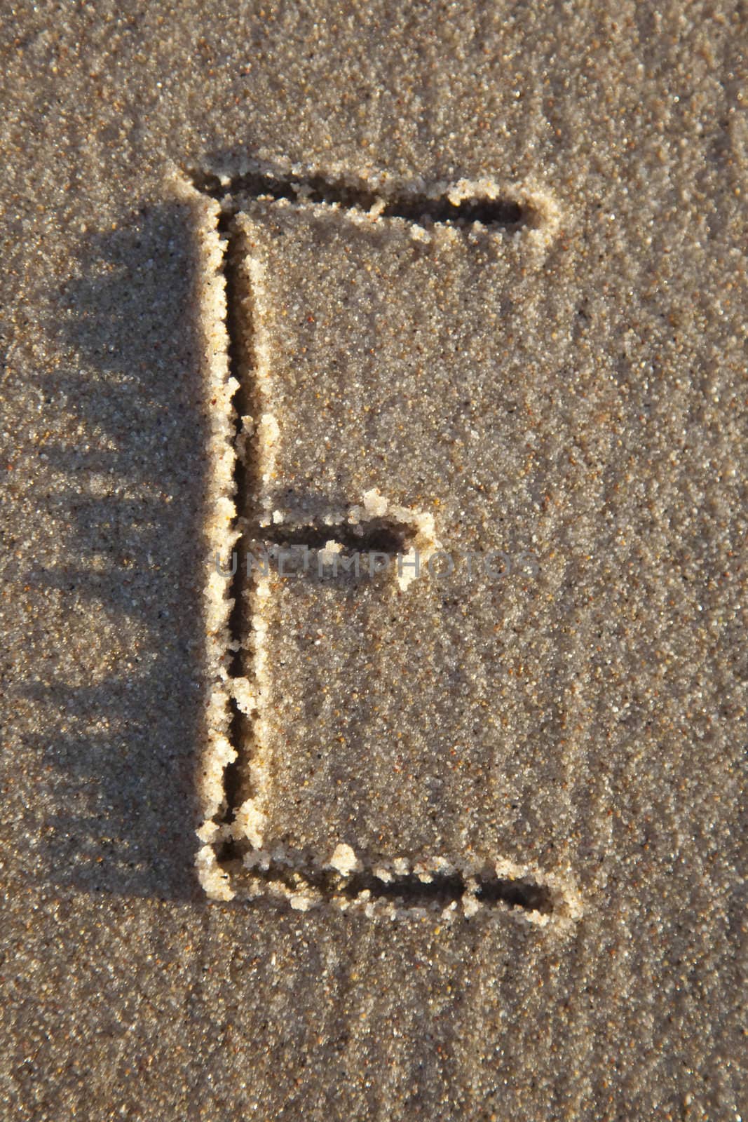 Letter written on wet sand by shiffti