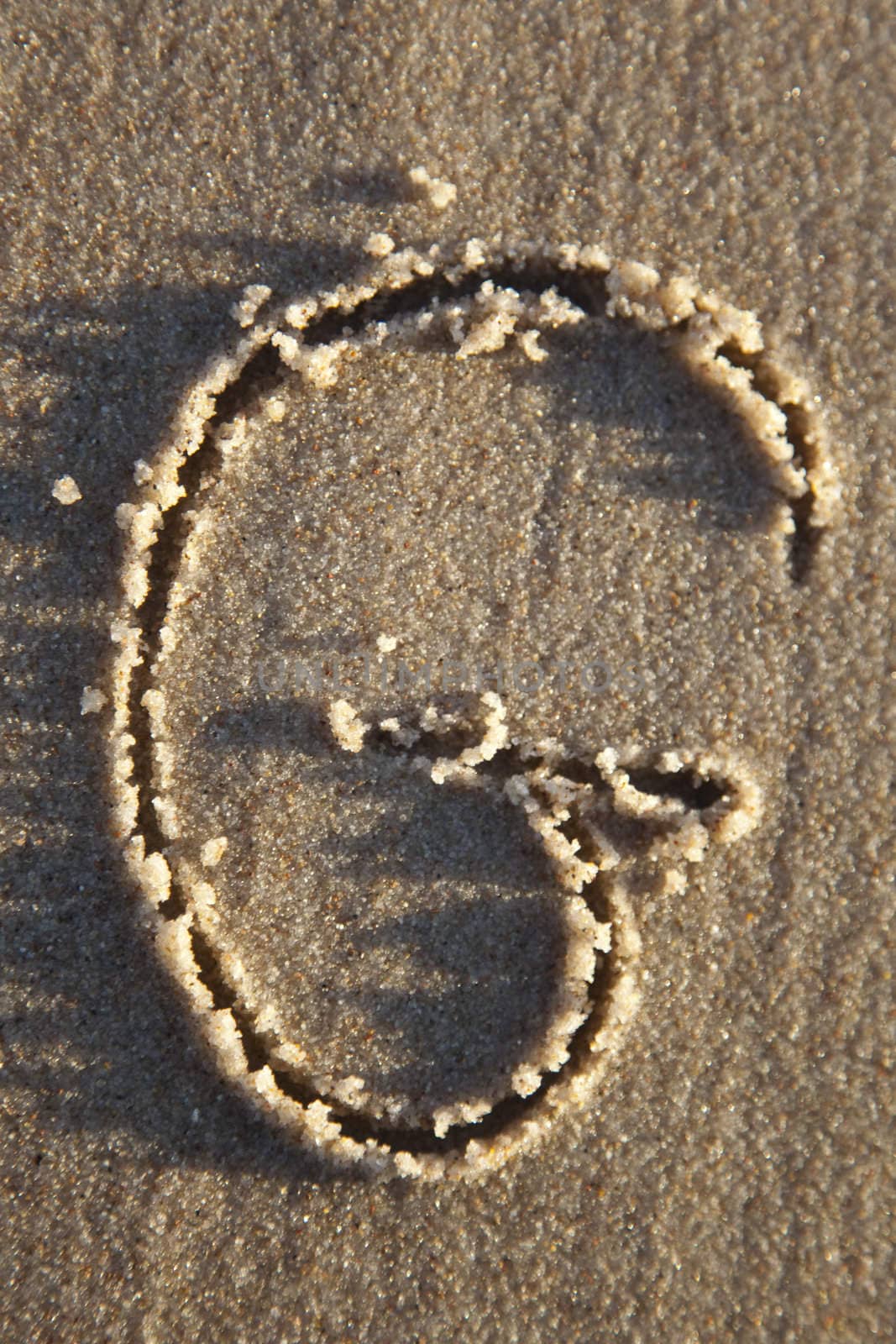 Letter written on wet sand by shiffti