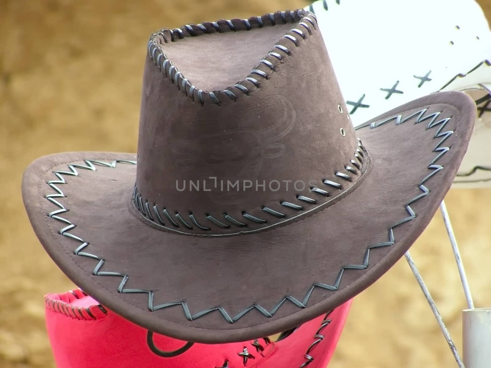 cowboy's hat against the sand background       