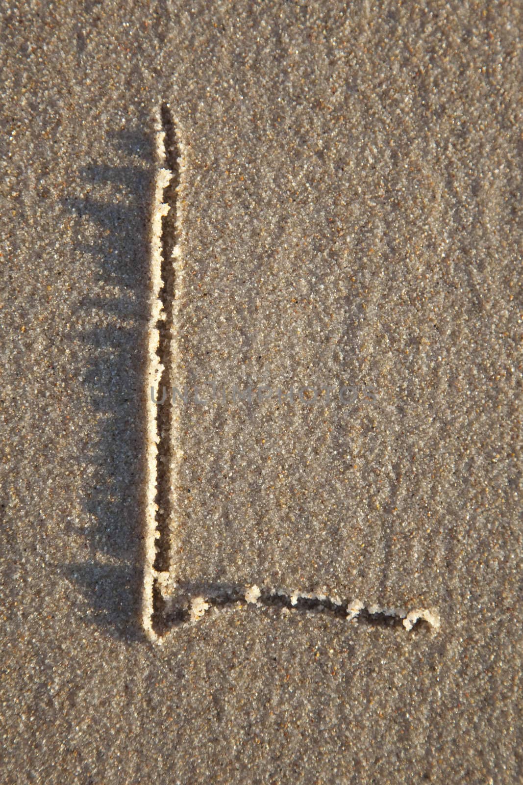 Letter on wet sand