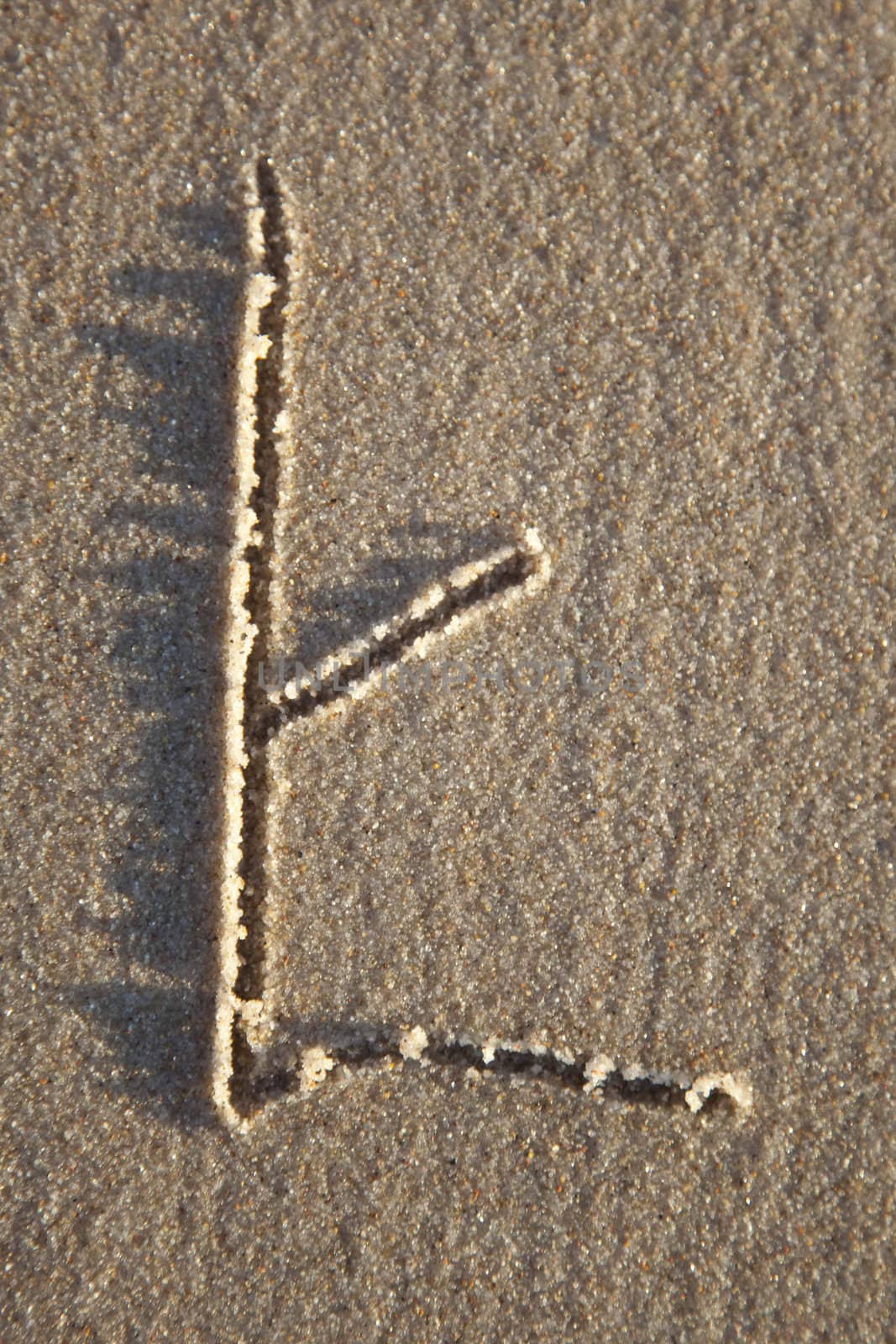 Letter on wet sand