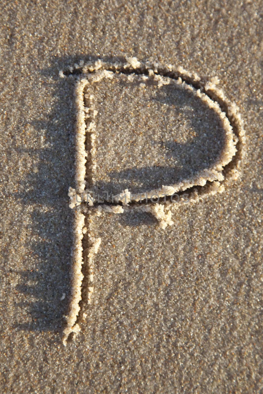 Letter on wet sand