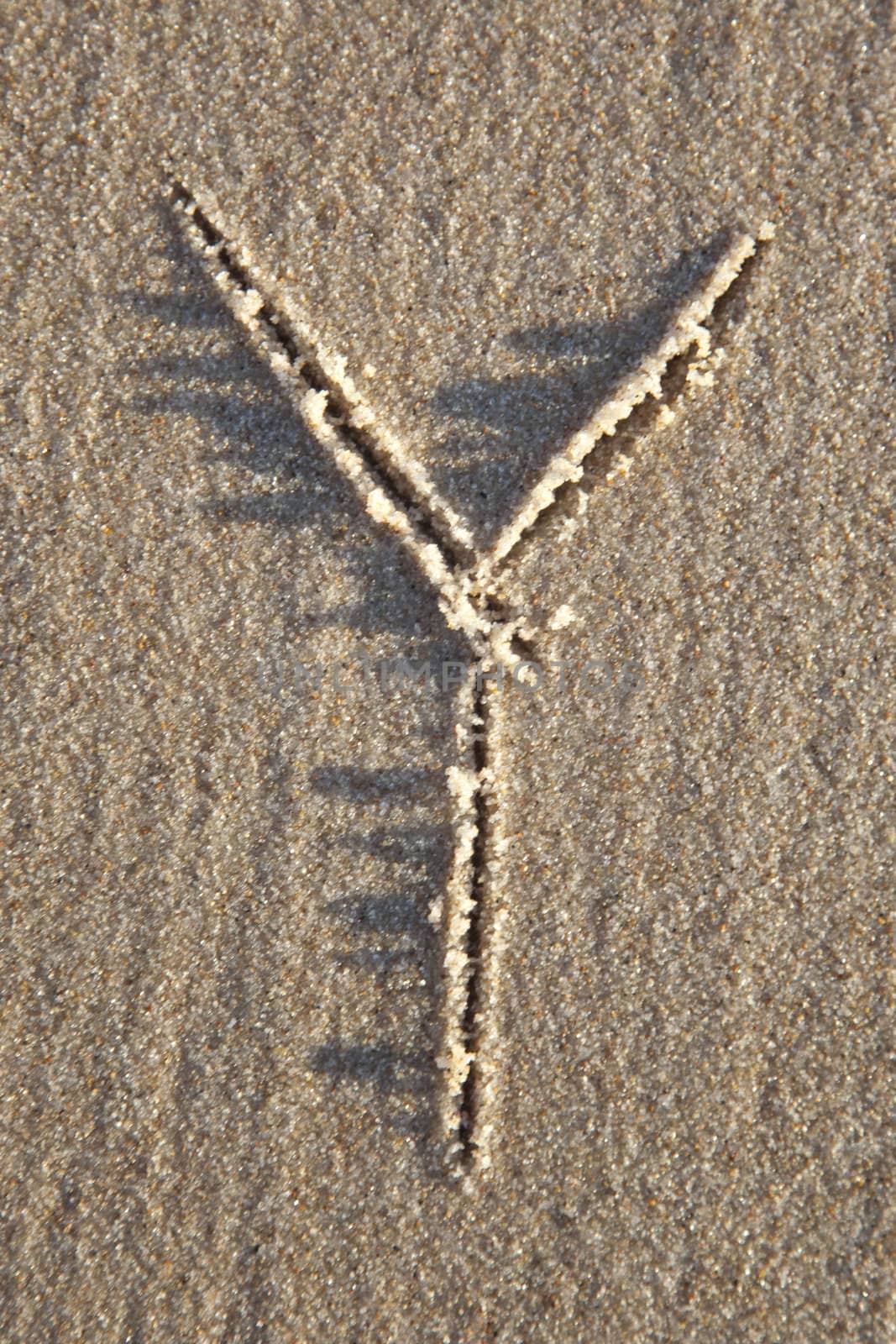 Letter on wet sand