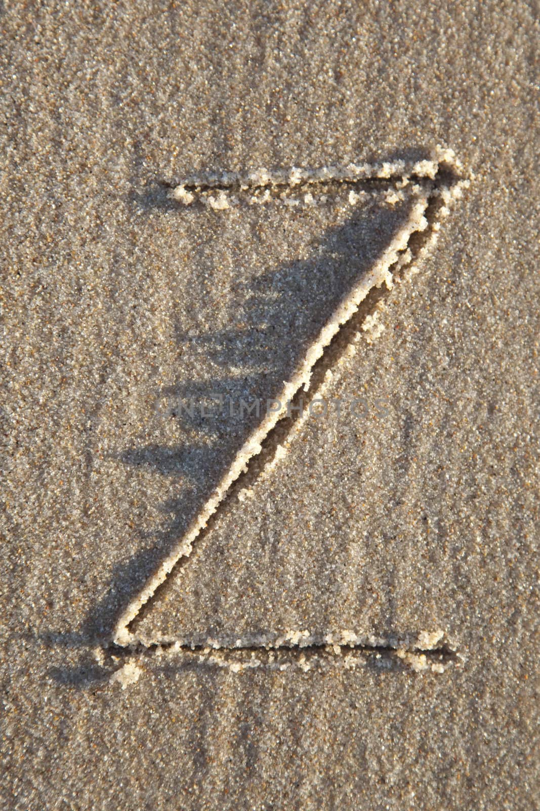 Letter on wet sand