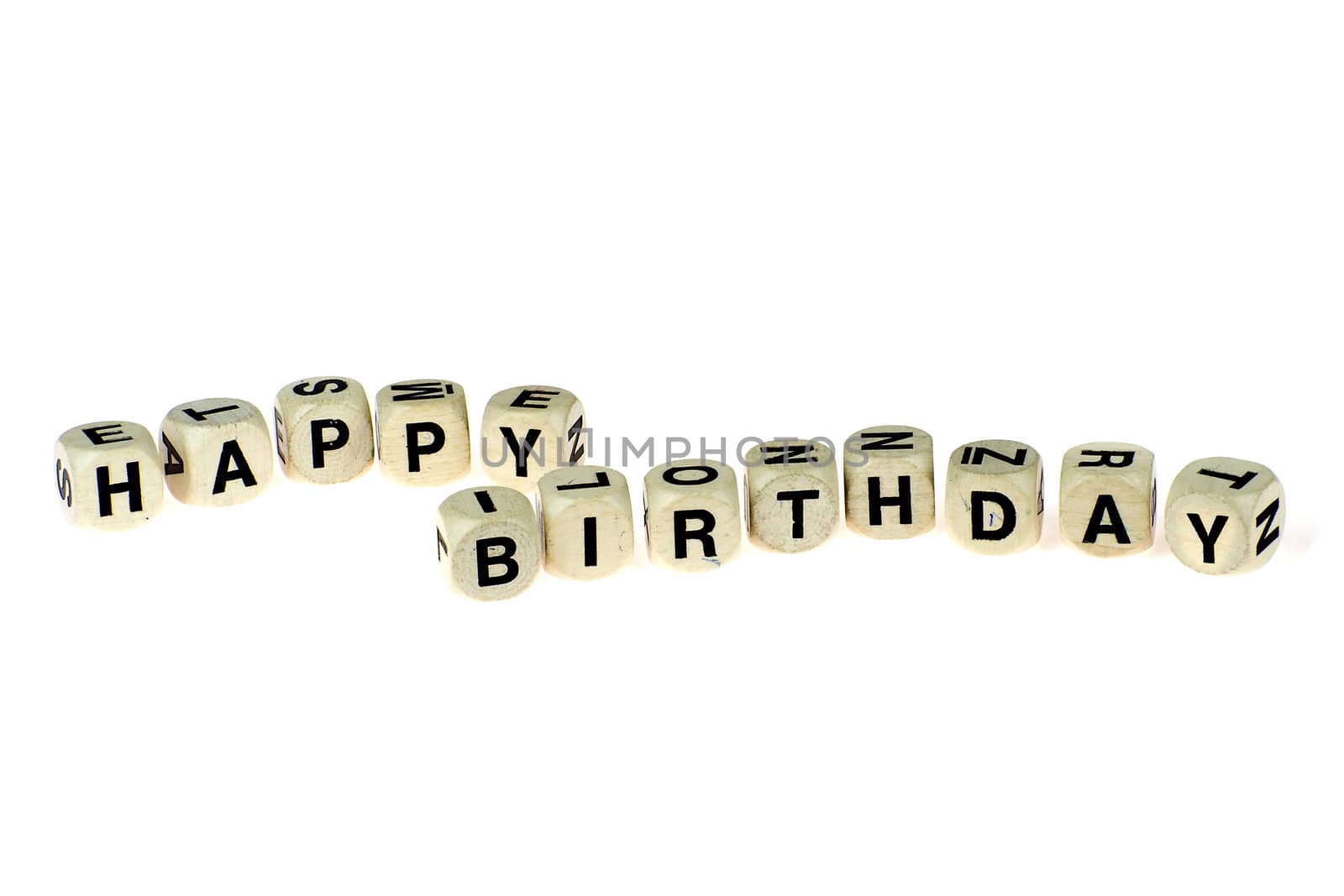 a lot of old dices with letters, spell out "happy birthday"