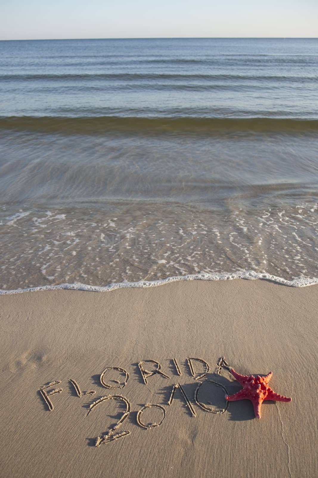 Text written in the beach