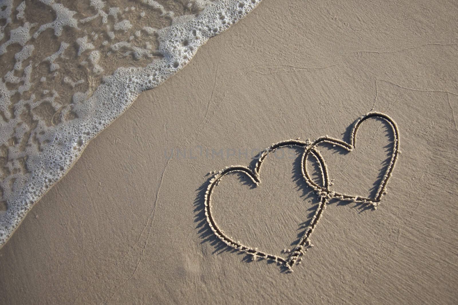 Hearts painted on wet sand