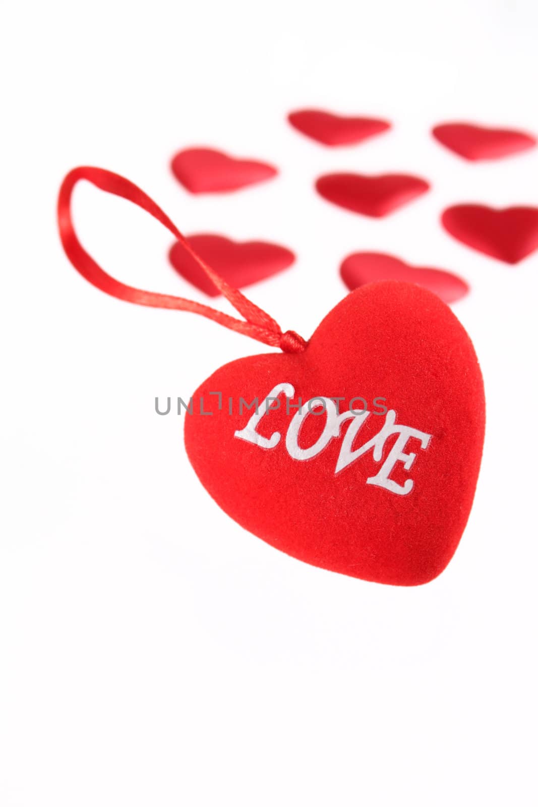 Red plush heart with an inscription removed close up