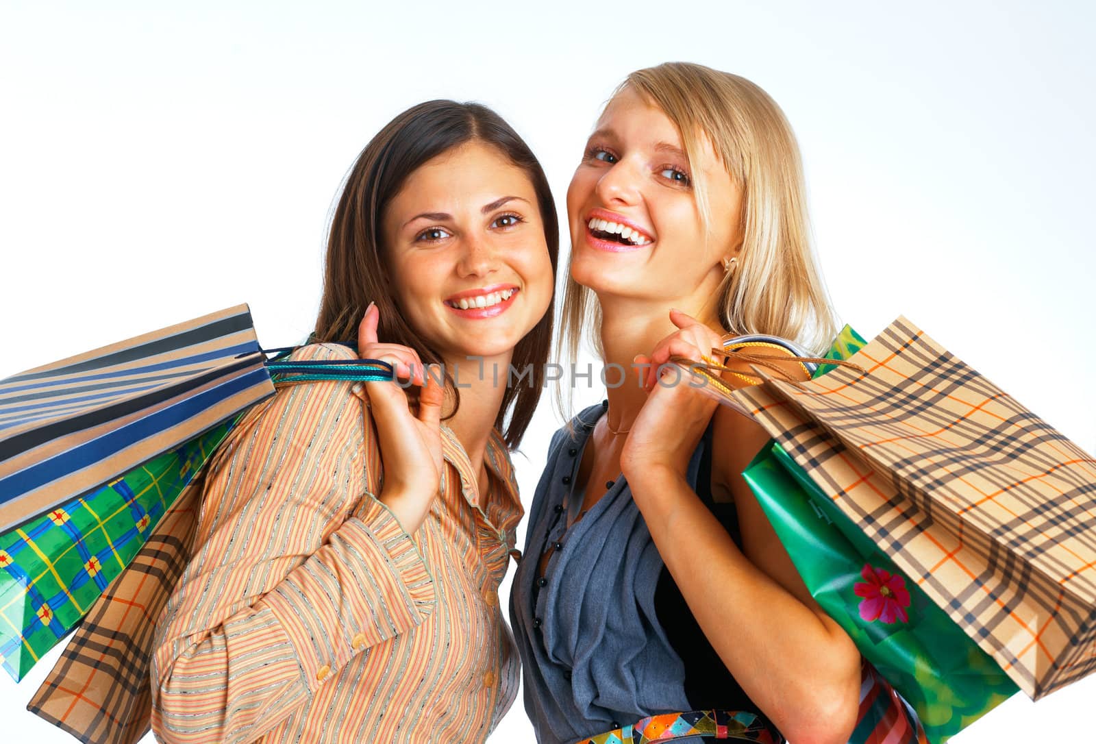 Close-up image of two happy shopers with parcels on white background