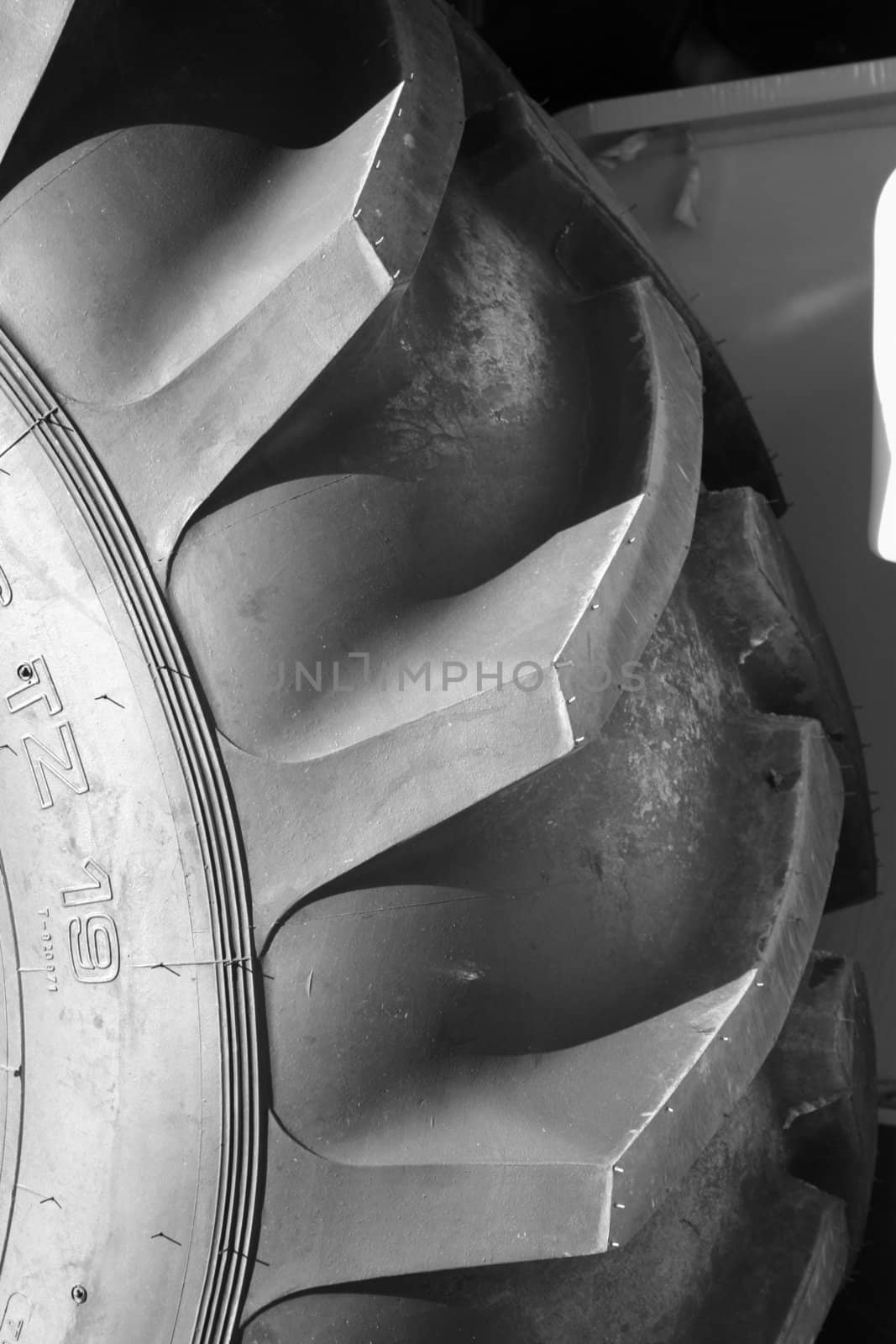 Tire cover of a tractor wheel from black rubber, (look similar images in my portfolio)