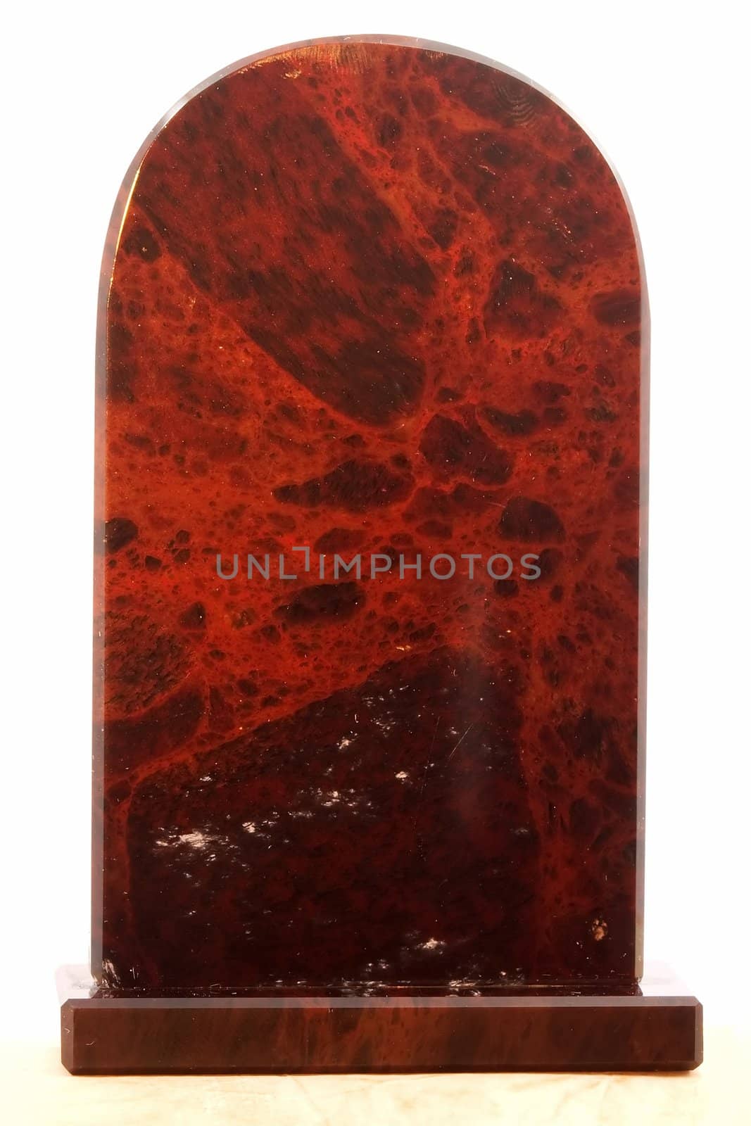 Red marble statue on white background