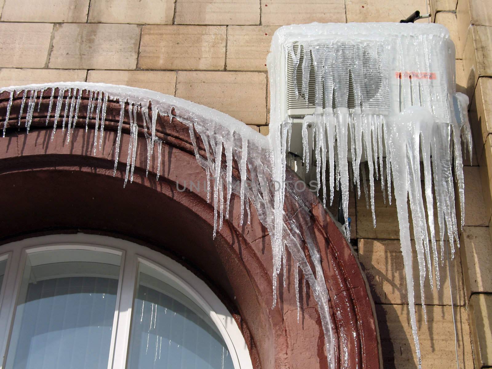Icicles on the conditioner in frosty day in Volgograd