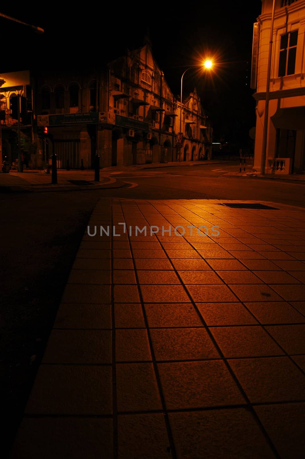 Old shophouses and quiet street at night