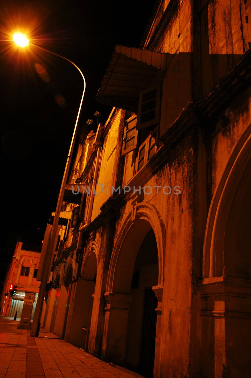 Old shophouses at night shot in perspective