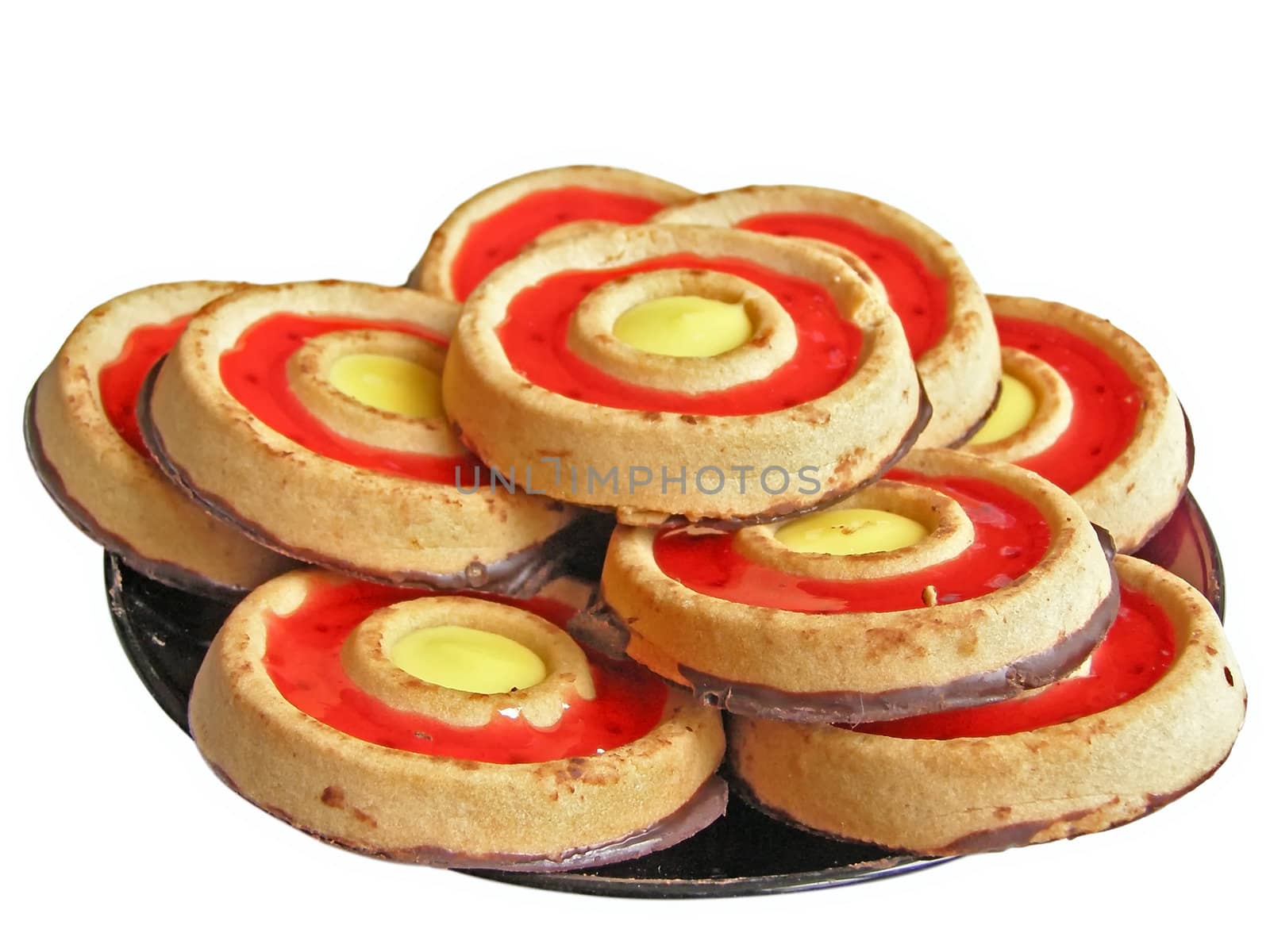 sweet cakes on the saucer over white background