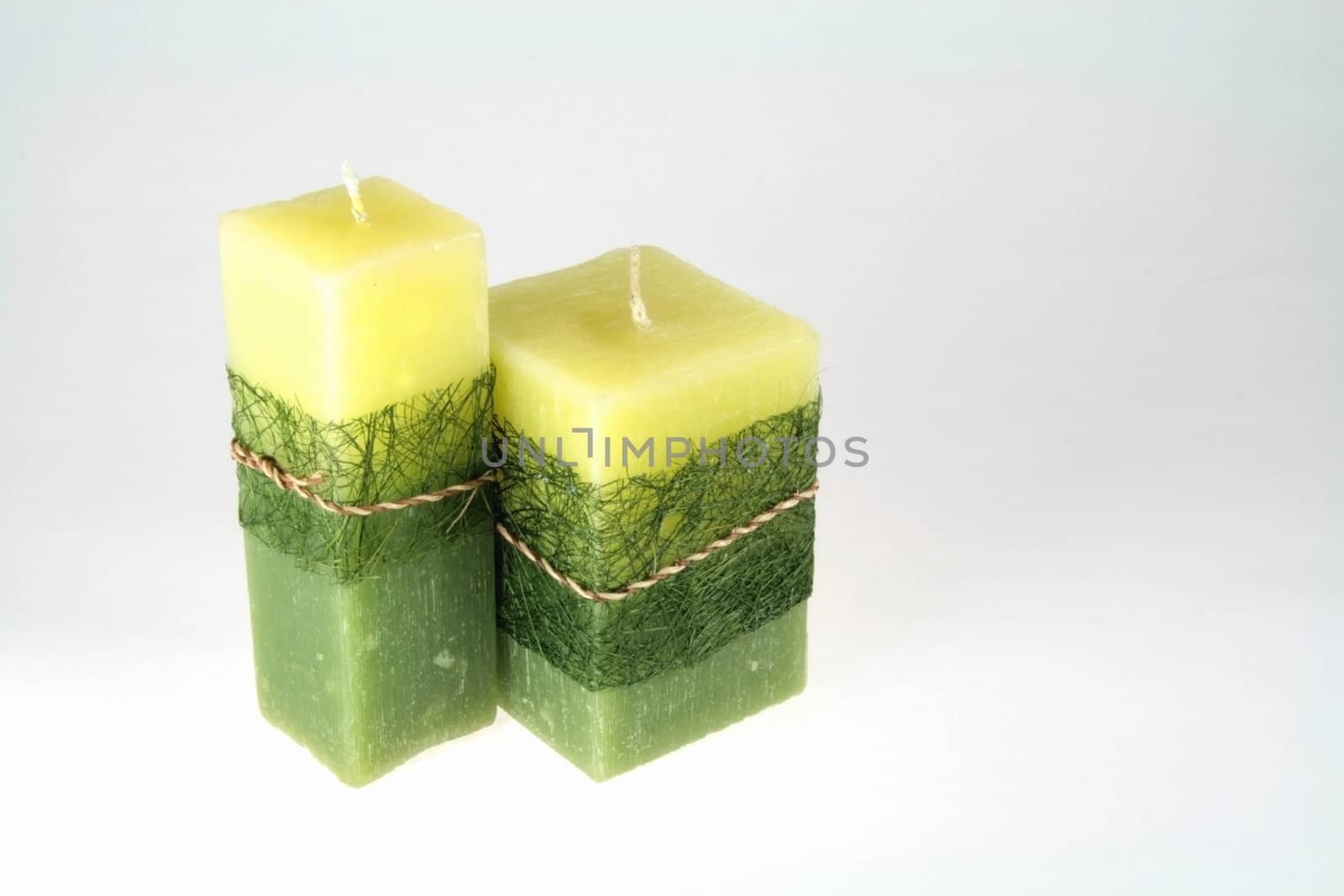 green fancy candle lights isolated on white background
