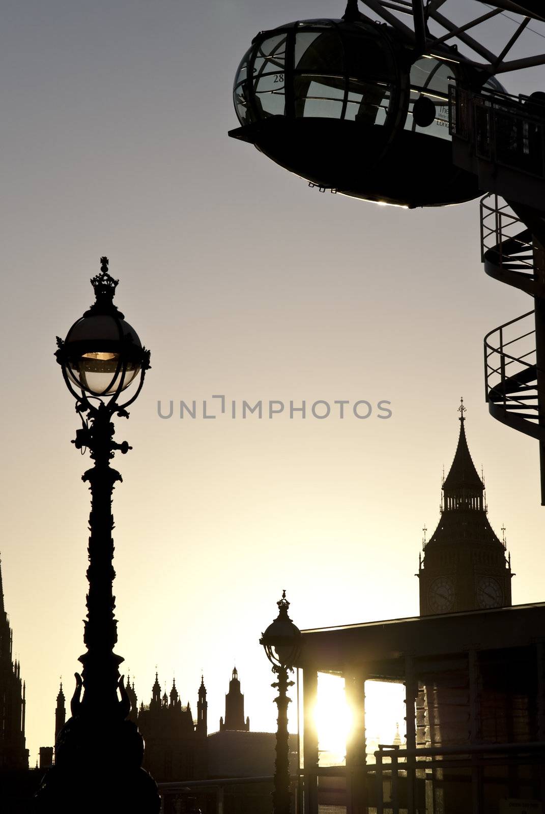 Detail of London Eye seen from Southbank. with Big Ben in the background.