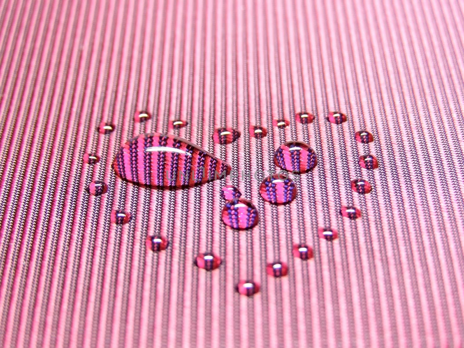 water drop among other drops in heart form