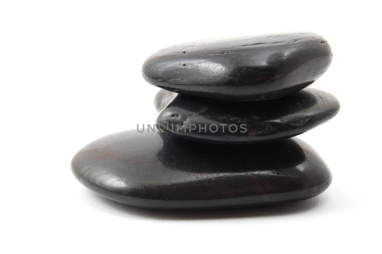 black stones in balance isolated on white background