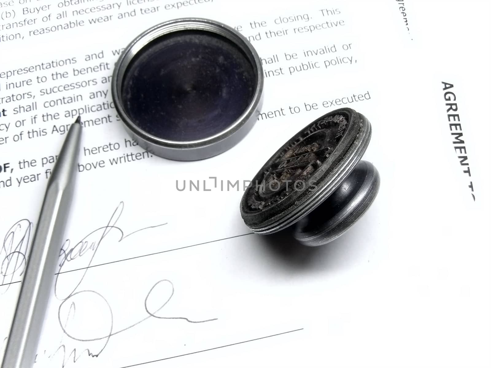 pen and stamp on the agreement  