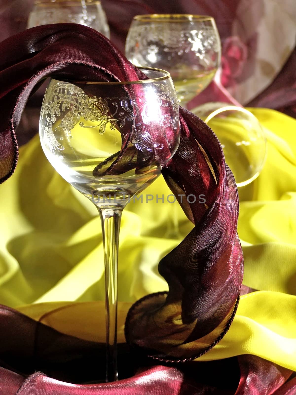 wineglasses against the red and yellow tissue