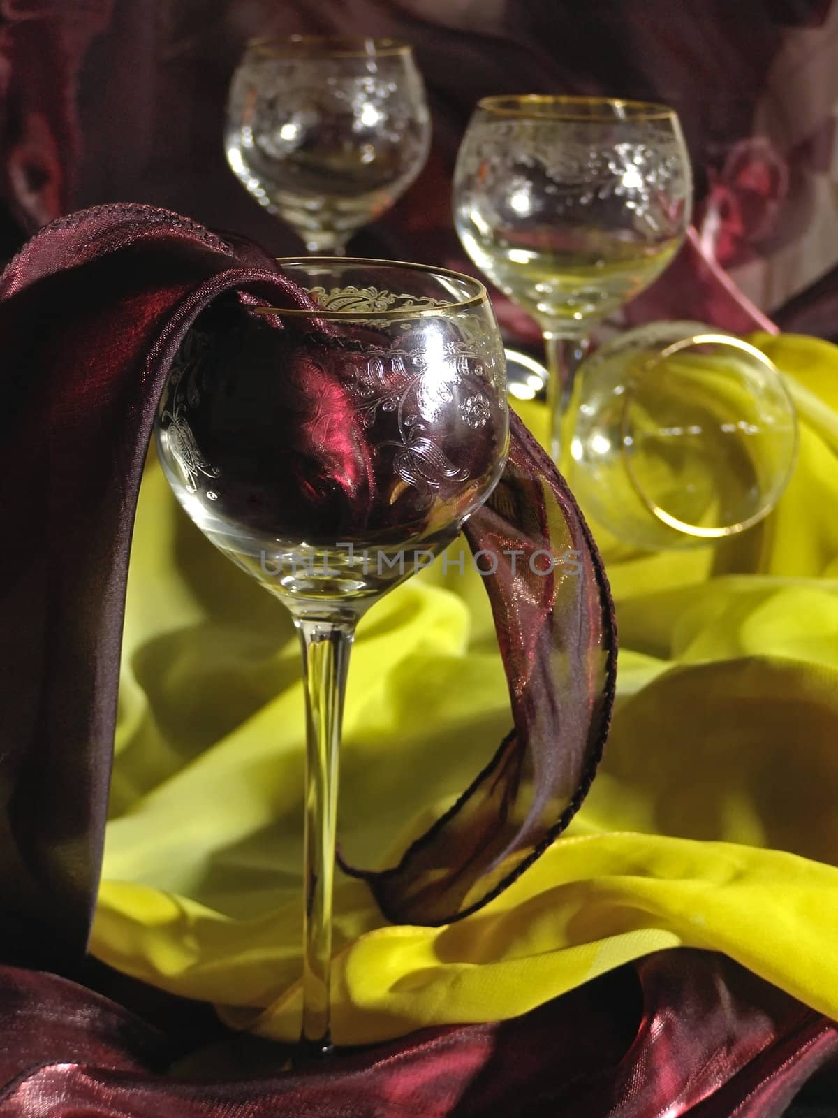 wineglasses against the red and yellow tissue
