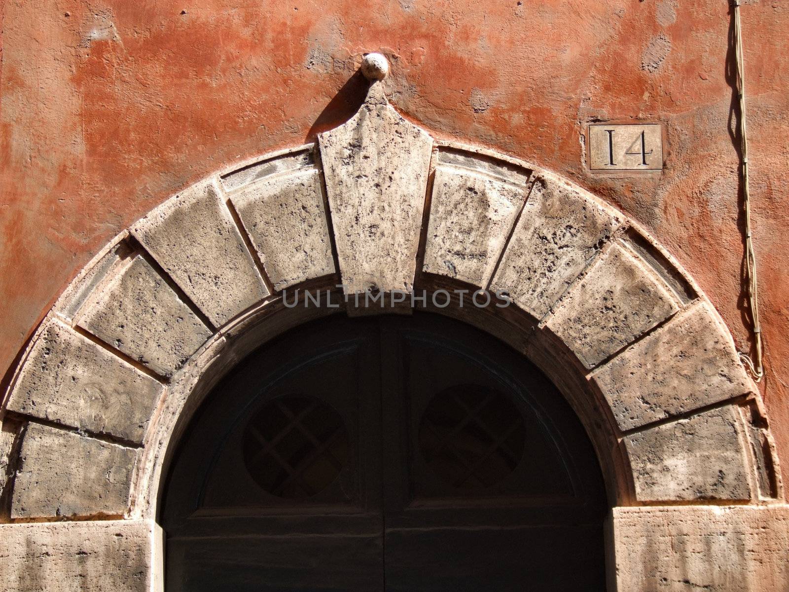 Red wall in Rome. Architecture detail in the Italian capital city.