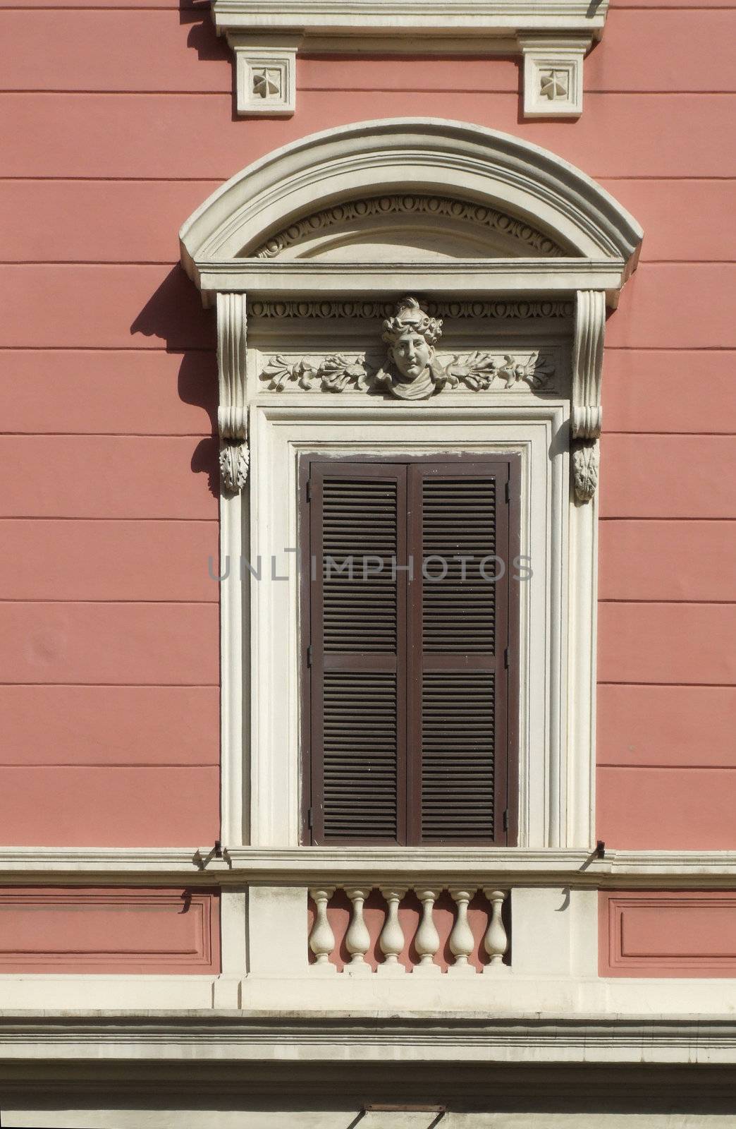Old decorated window with shutters - Rome architecture.