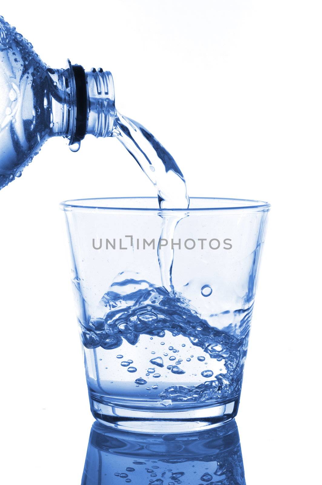 filling a glass with water showing a food concept