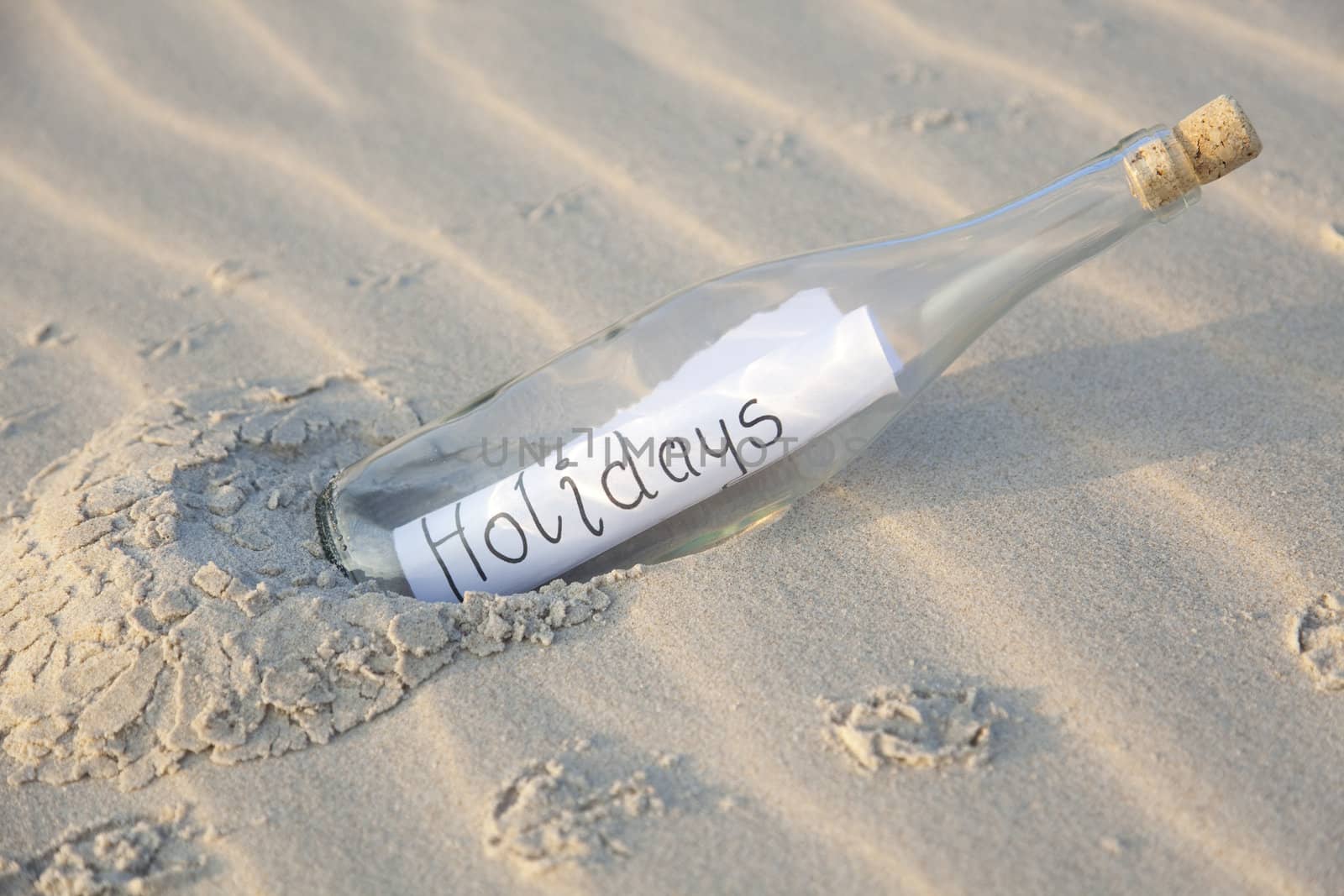 Bottle in sand by shiffti