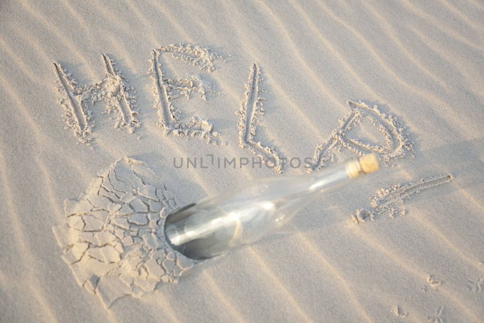 A clear glass bottle washed up on the beach by shiffti