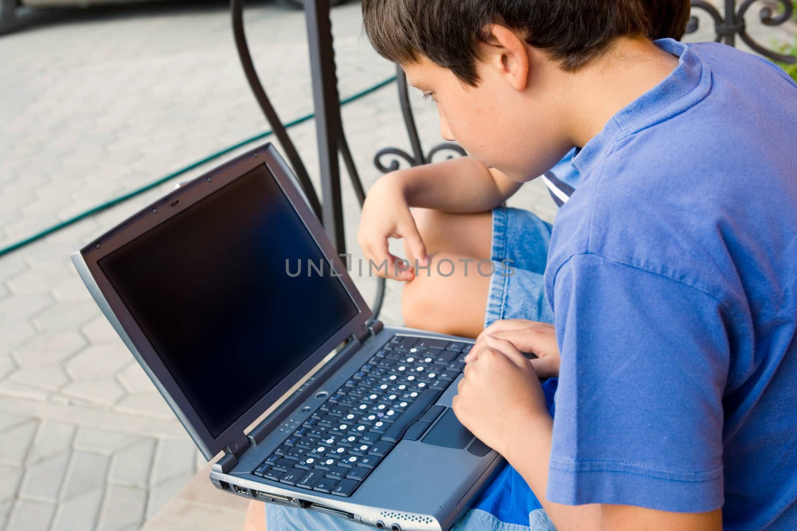 Two cute boy study on computer 
