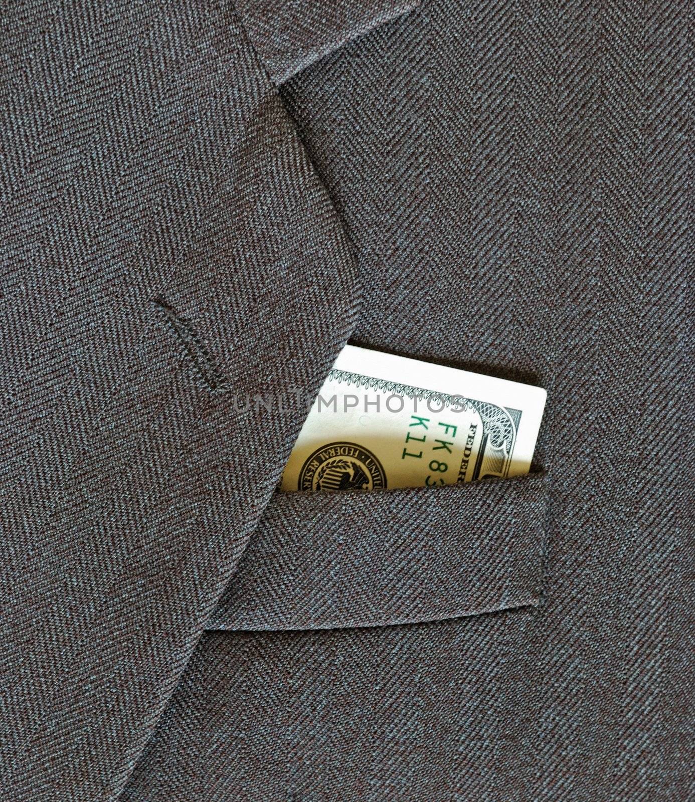 100 dollars, peeking out from the pocket of coat