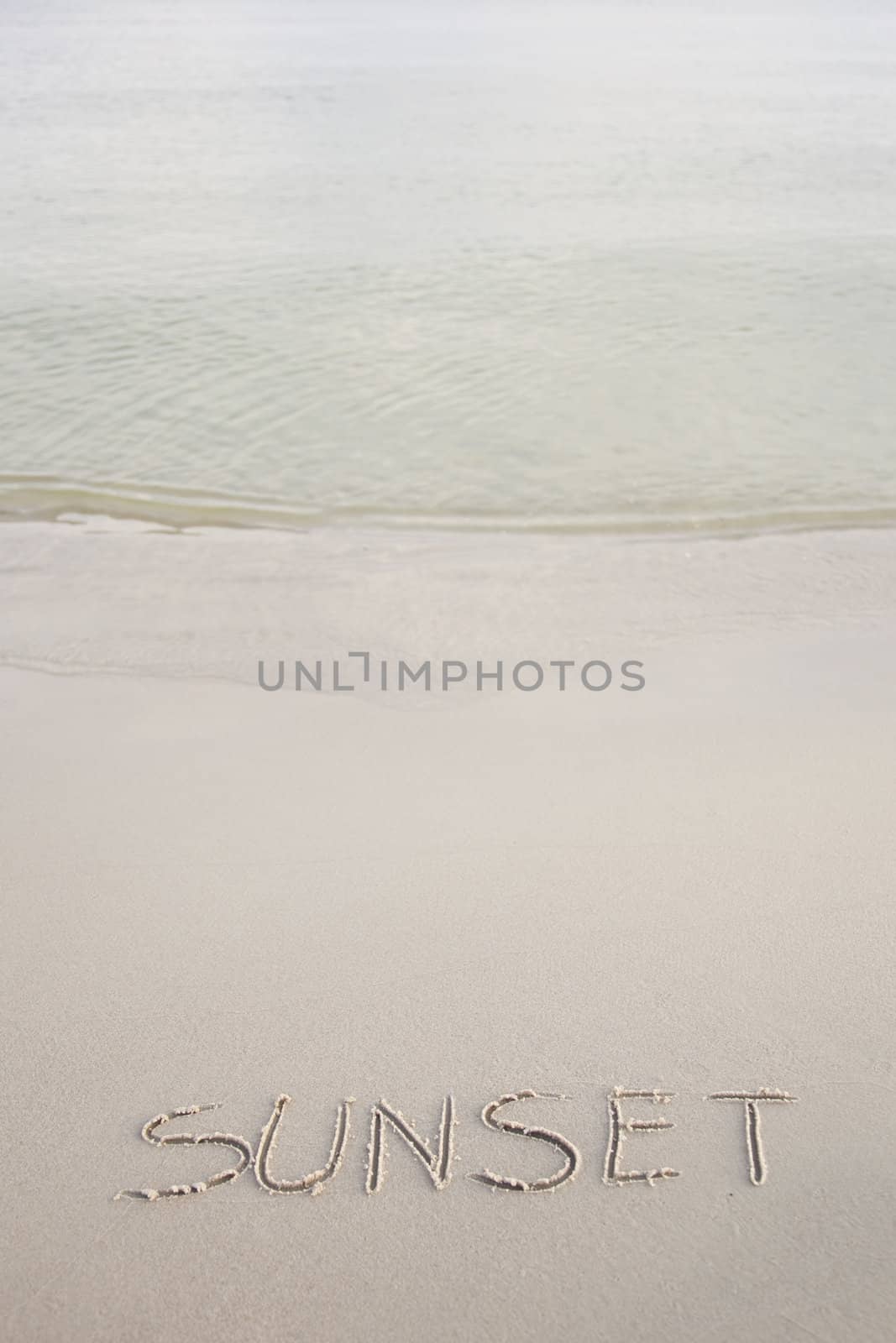 Sunset written in the beach