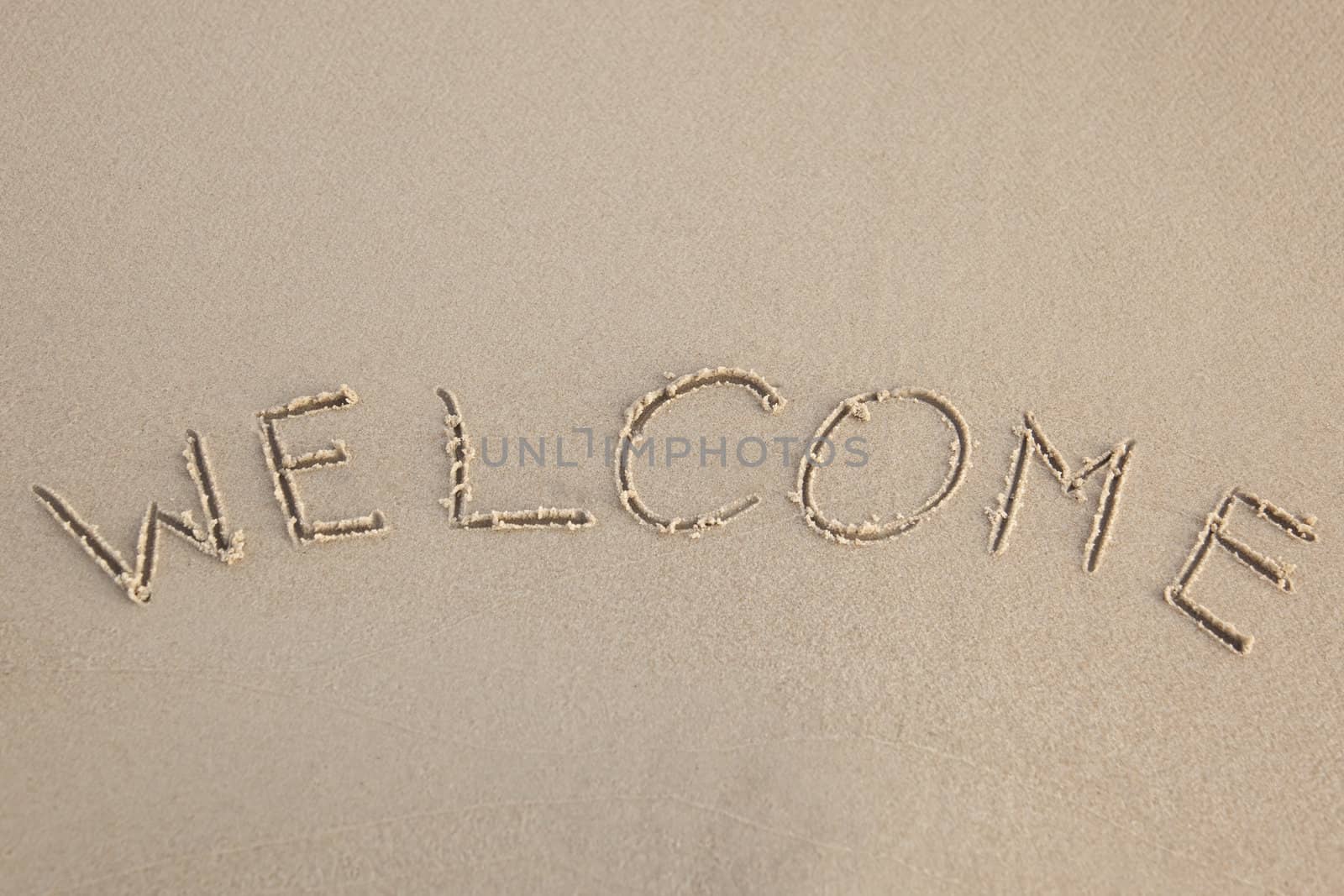 Welcome written in the beach by shiffti