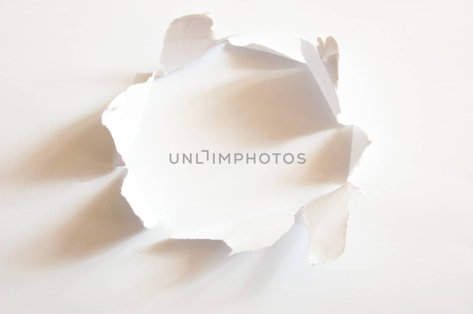 hole with copyspace in blank sheet of paper