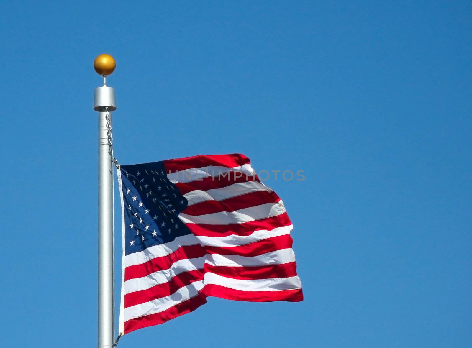 The United States of America Flag snapping in the wind