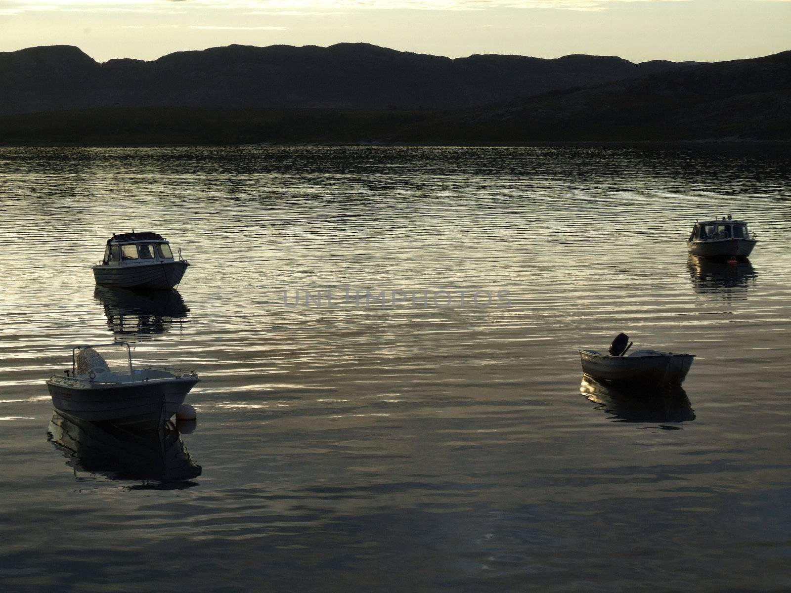 Boats in the light of sunset by tupungato