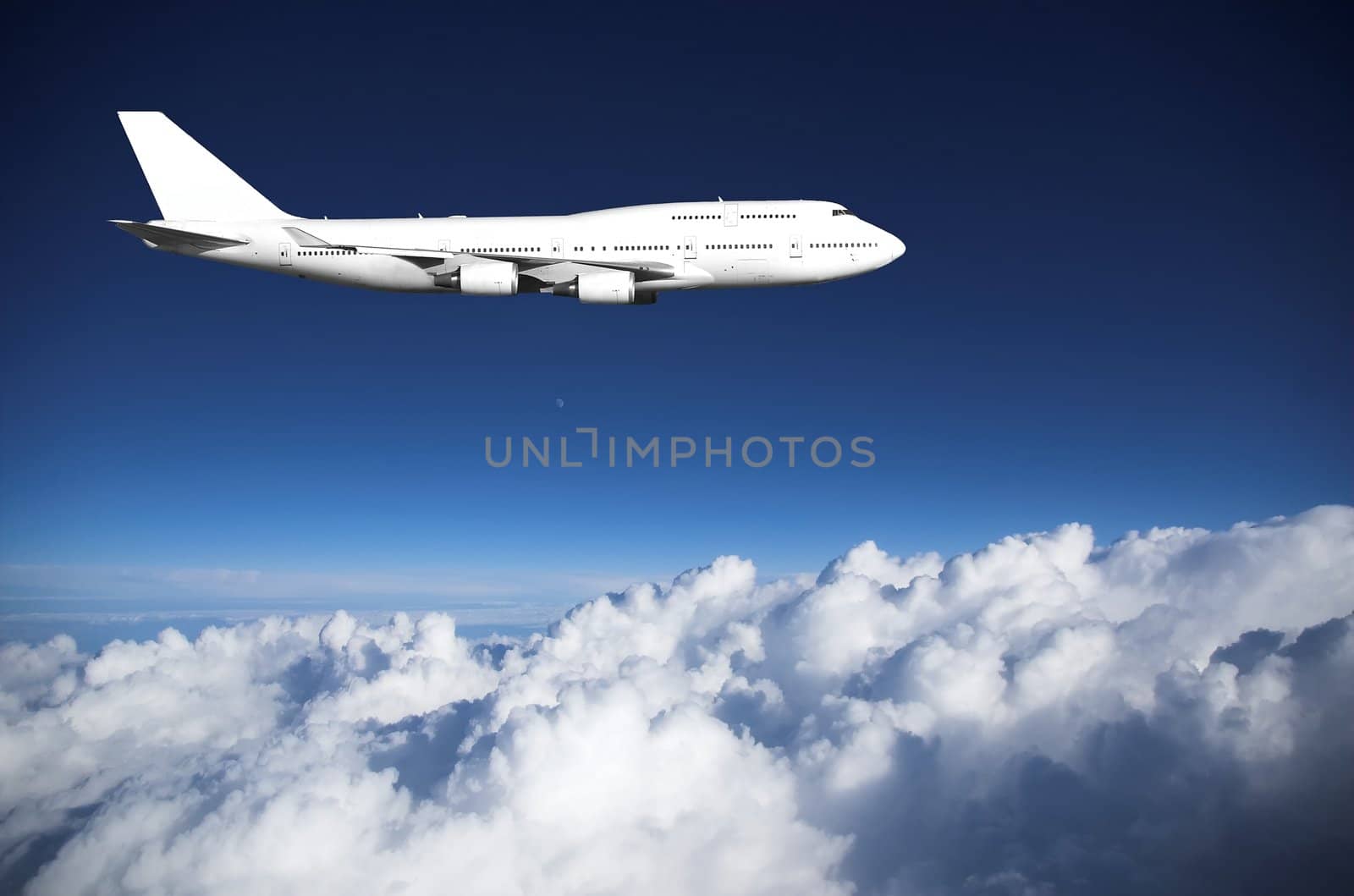 Jumbo jet in level flight high above clouds