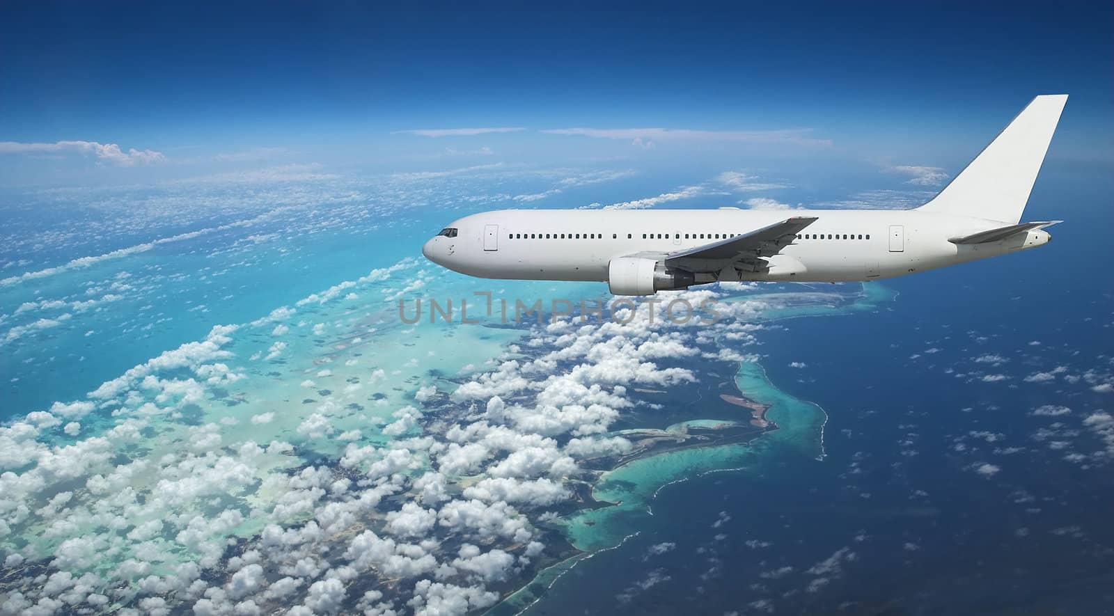 Large airliner arriving over exotic vacation destination